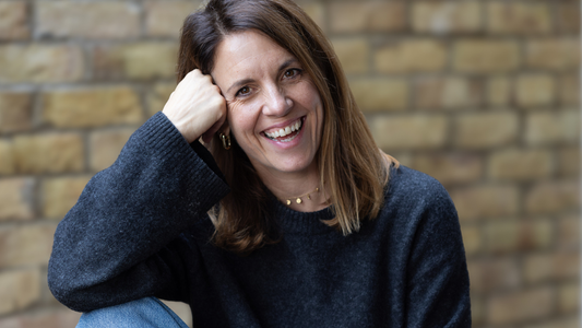 Lou Desborough Designer and Astrologist in photo smiling