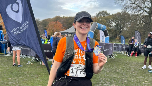 Bethany Wright Founder of the Not There Yet Project with Half Marathon Medal