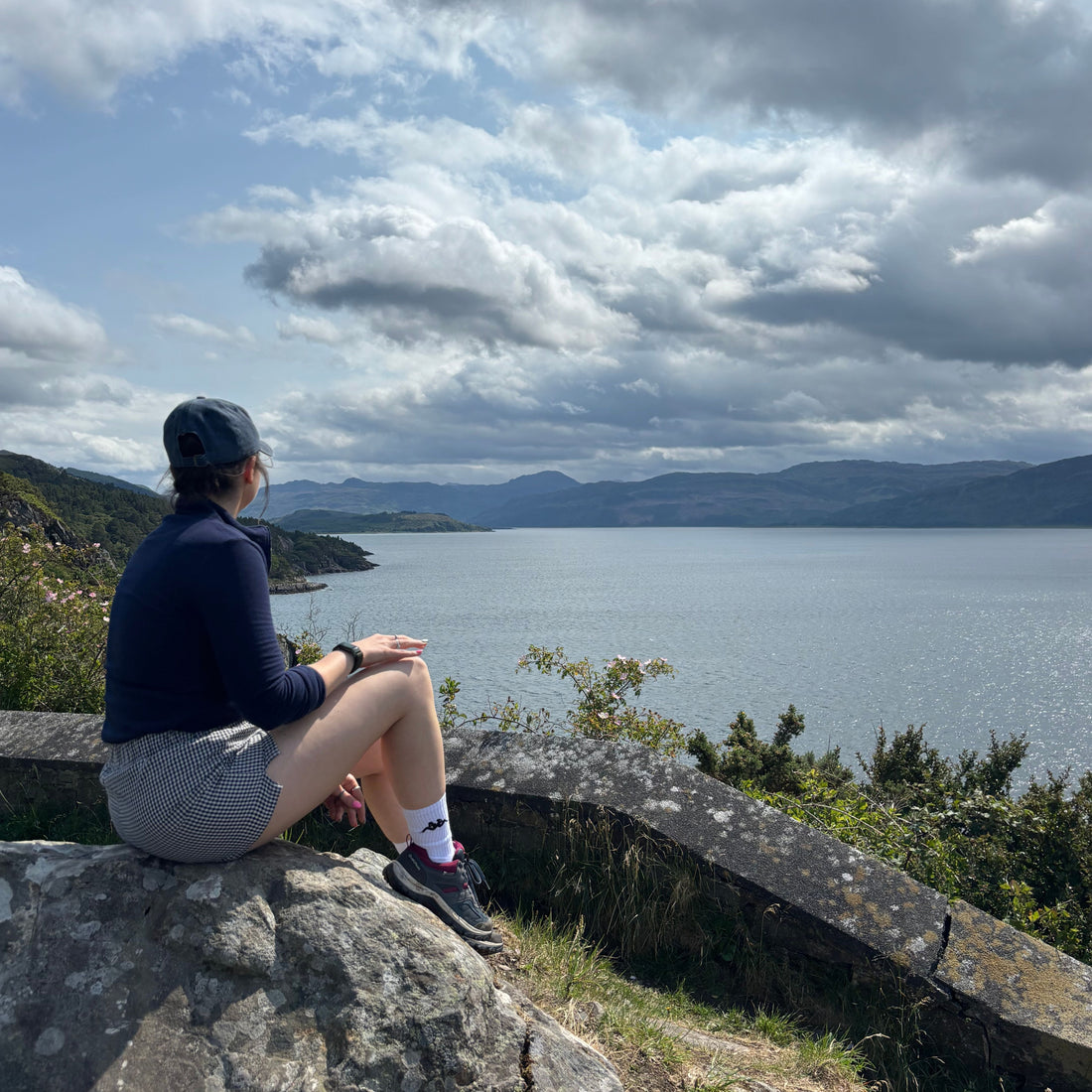 Founder of The Not There Yet Project Bethany Wright in Scotland looking over loch