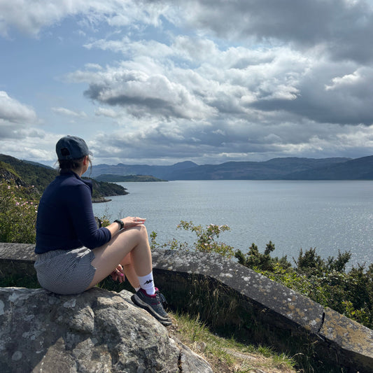 Founder of The Not There Yet Project Bethany Wright in Scotland looking over loch