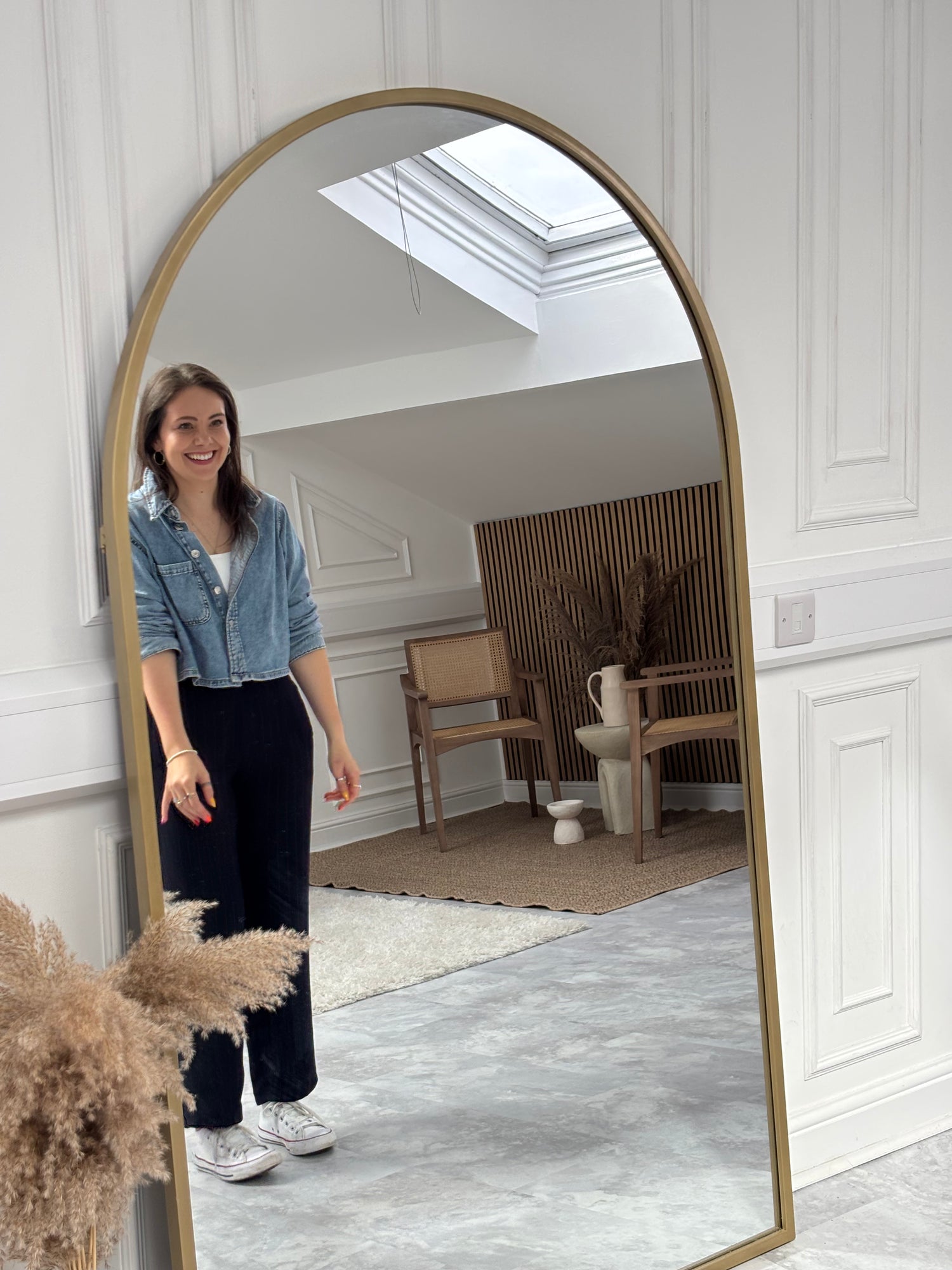 Founder of the Not There Yet Project Beth Wright in a mirror smiling